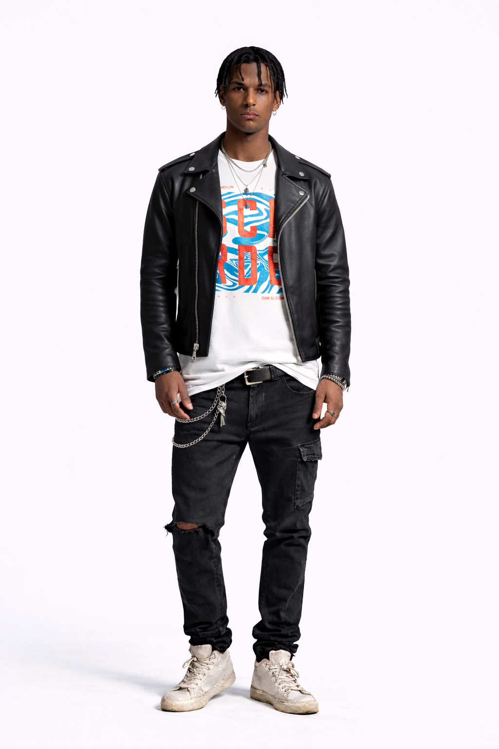 Man wearing a black leather jacket, white t-shirt with colorful design, and dark jeans on a white background