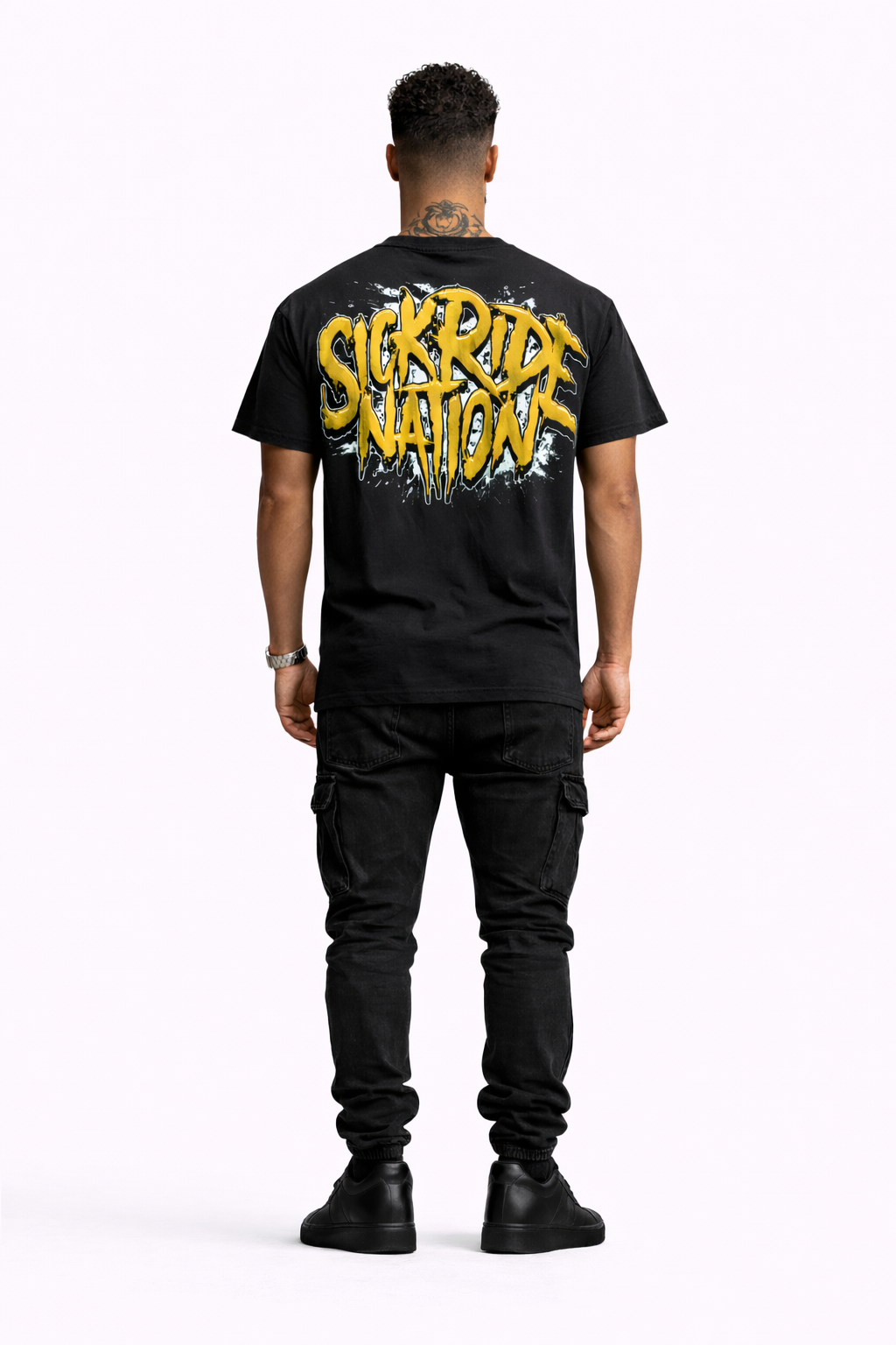 Person wearing a black t-shirt with 'Serrv Ride Nation' text on the back, standing against a white background.