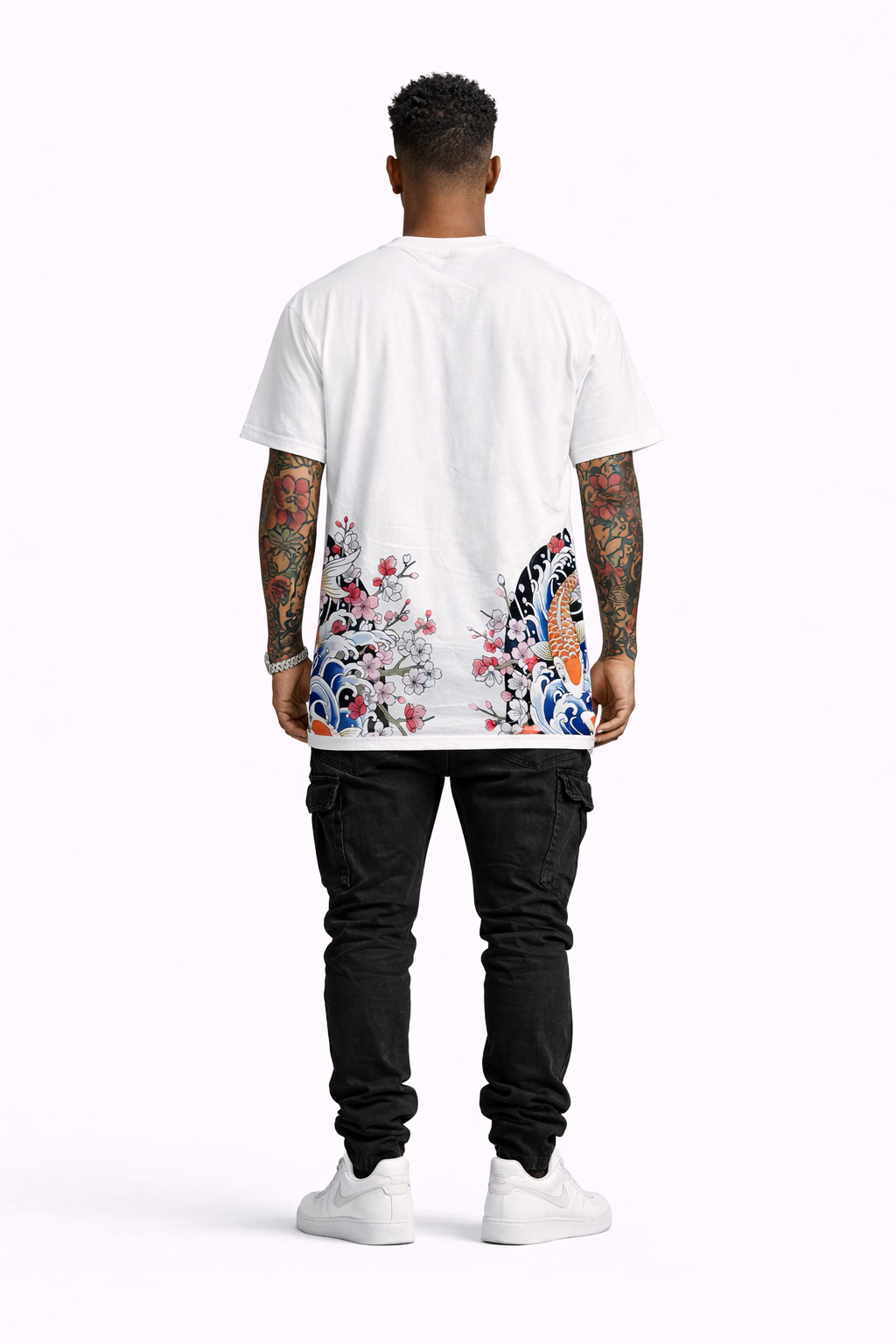 Person wearing a white t-shirt with colorful designs on the back, standing against a white background