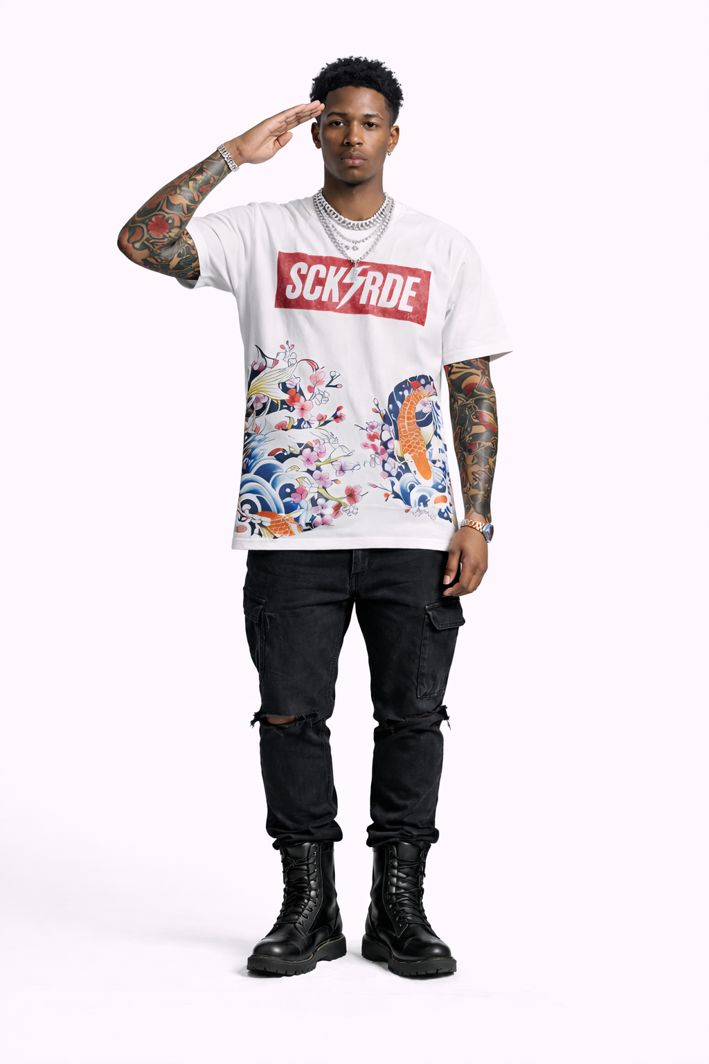 Person wearing a white t-shirt with colorful graphics and text, standing against a white background